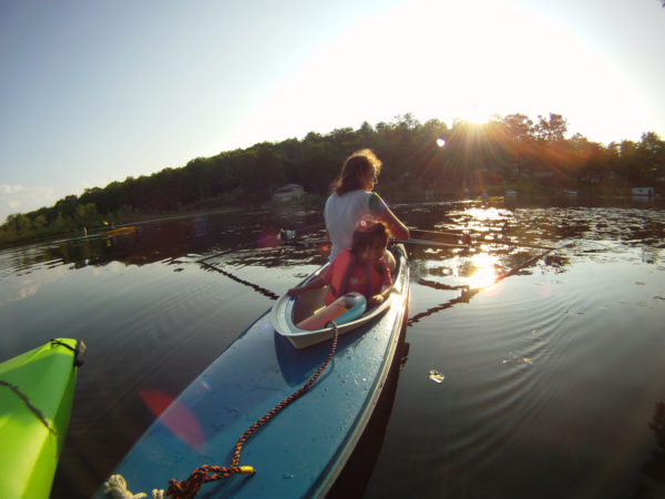 Dawn Smith-Pliner and Isabella on a kayak in a lake in Vermont.