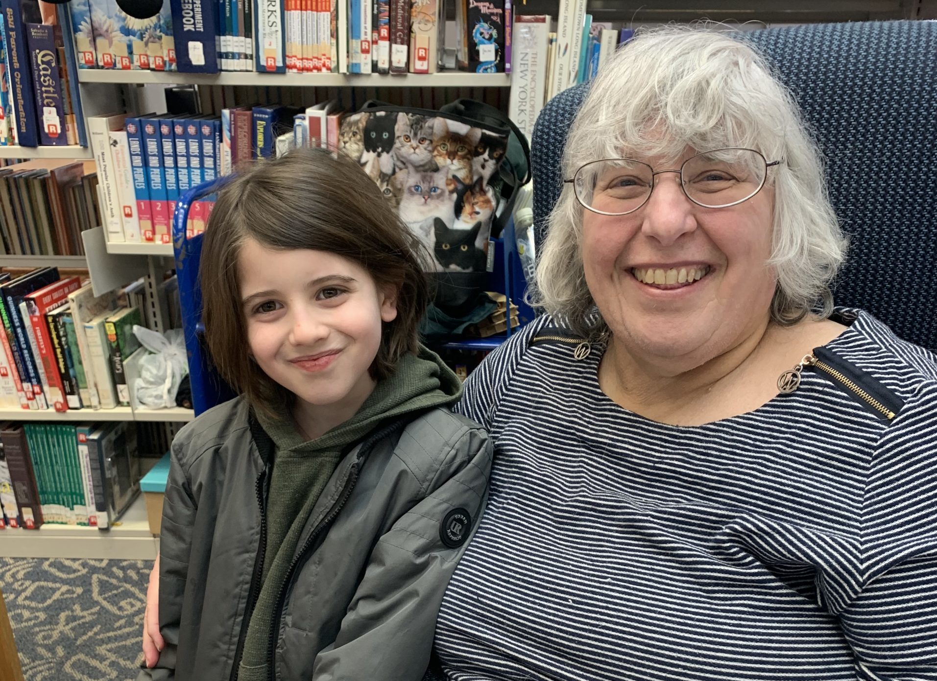 Children's librarian, Faye Lieberman and one of the boys who frequents her library